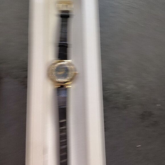 Elegant Black and Gold Watch - Picture 3 of 4